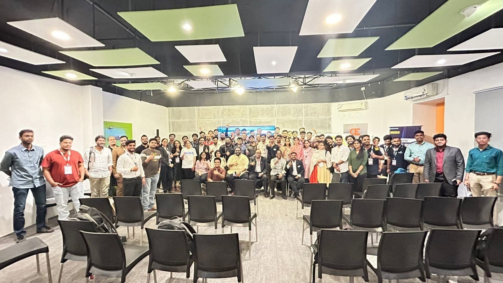 Attendees and speakers gathered for a group photo at the 13th conference