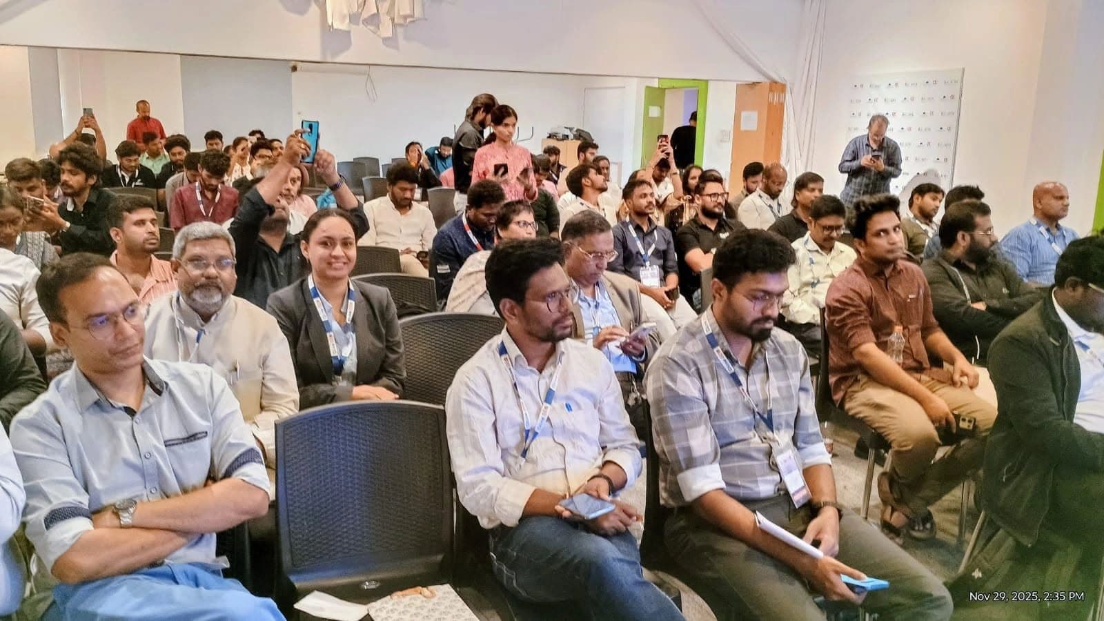 Attendees taking part in a conference session